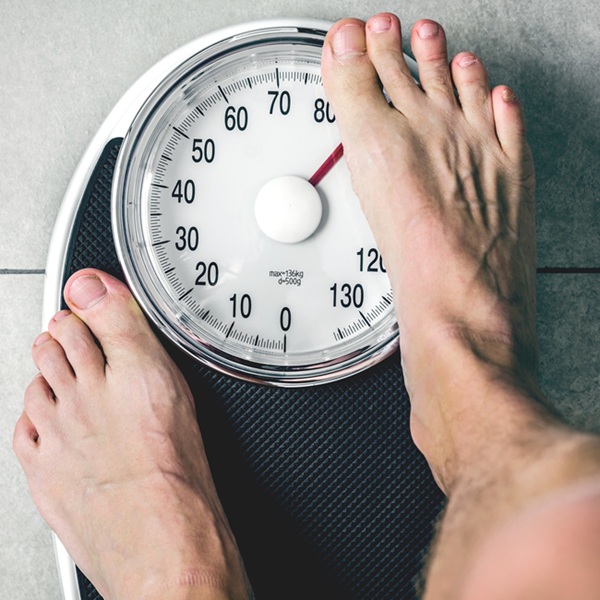 Weight Loss Treatments for men buy online from Urban TRT Weight Loss Treatments buy online from Urban TRT - man on scales